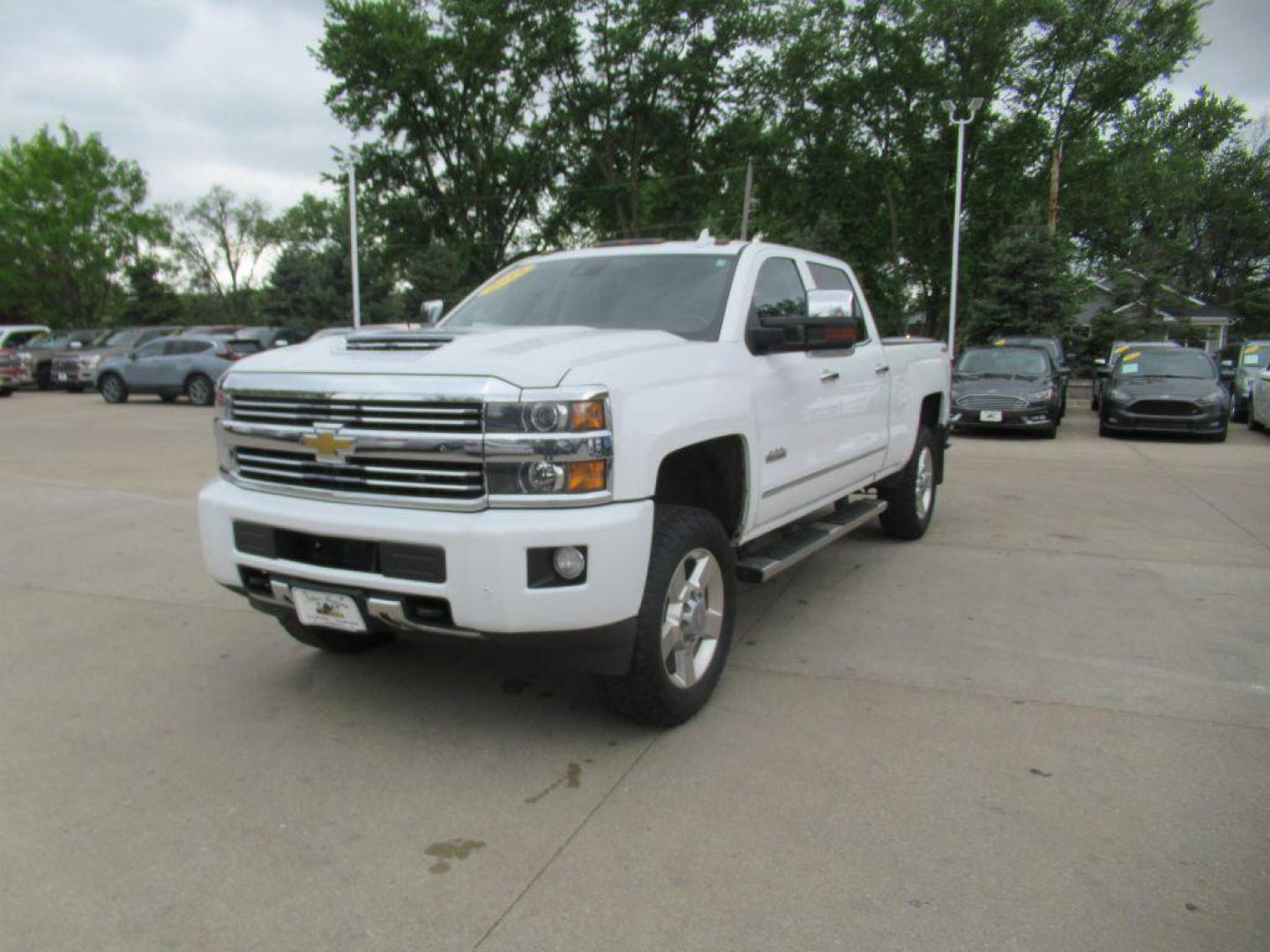 2015 WHITE CHEVROLET SILVERADO 2500 HIGH COUNTRY (1GC1KXE89FF) with an 6.6L engine, Automatic transmission, located at 908 SE 14th Street, Des Moines, IA, 50317, (515) 281-0330, 41.580303, -93.597046 - Photo#0