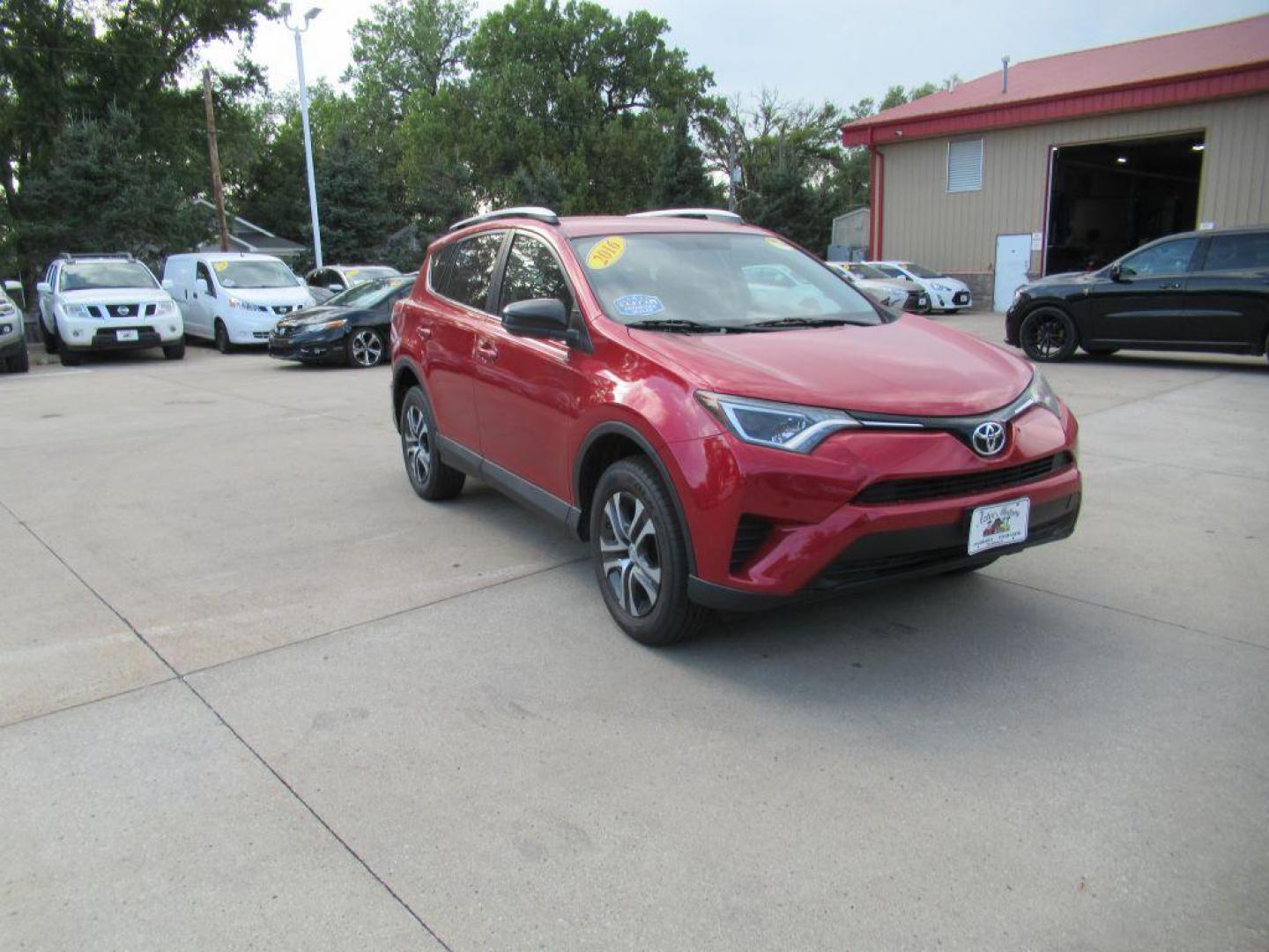 2016 RED TOYOTA RAV4 LE (2T3BFREV7GW) with an 2.5L engine, Automatic transmission, located at 908 SE 14th Street, Des Moines, IA, 50317, (515) 281-0330, 41.580303, -93.597046 - Photo#2