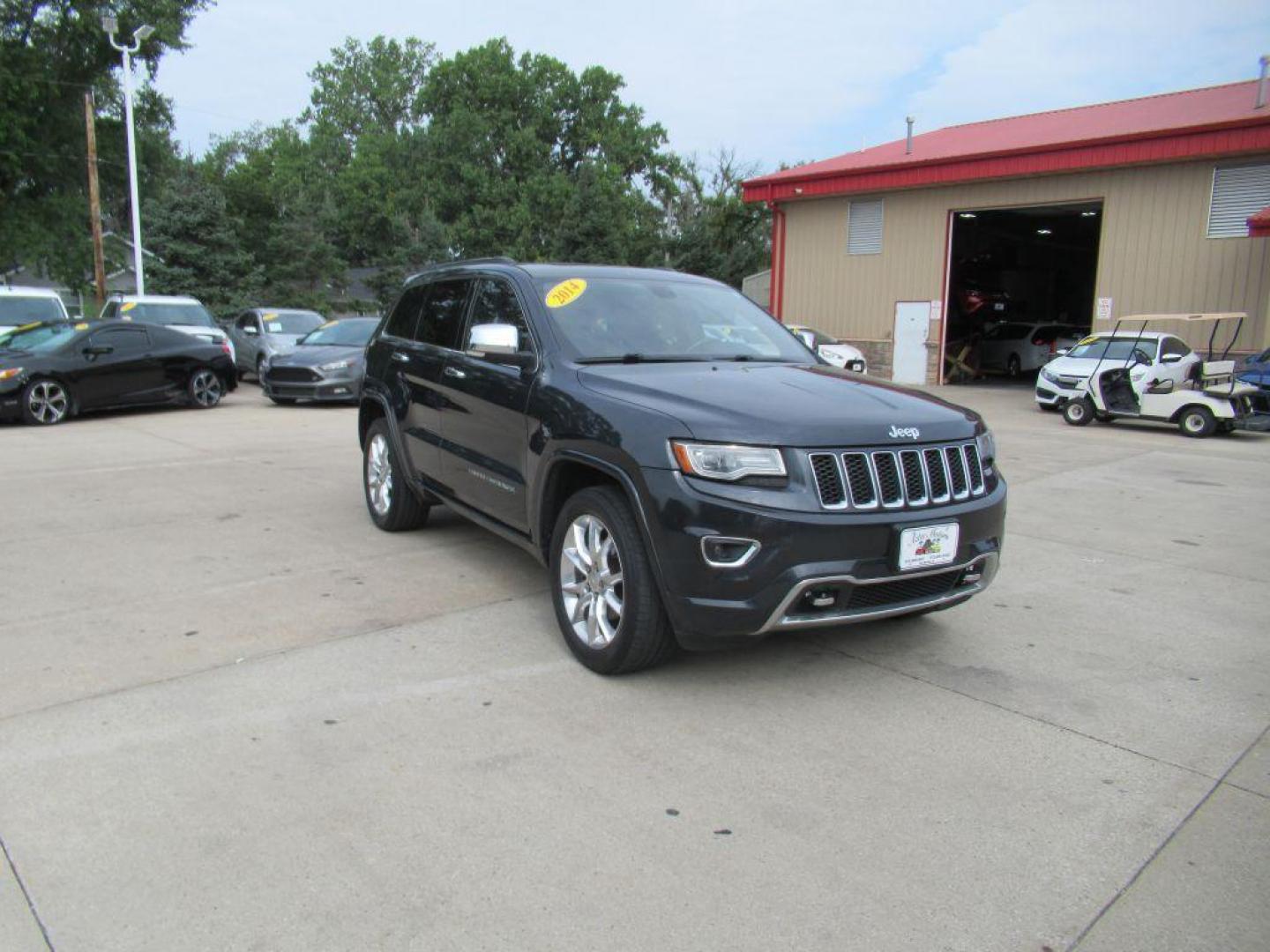 2014 BLACK JEEP GRAND CHEROKEE OVERLAND (1C4RJFCG5EC) with an 3.6L engine, Automatic transmission, located at 908 SE 14th Street, Des Moines, IA, 50317, (515) 281-0330, 41.580303, -93.597046 - Photo#2